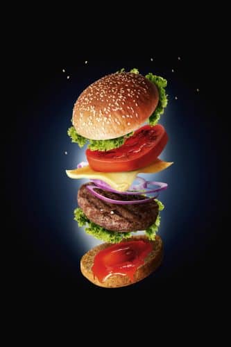 Hamburger with flying ingredients - fast food concept